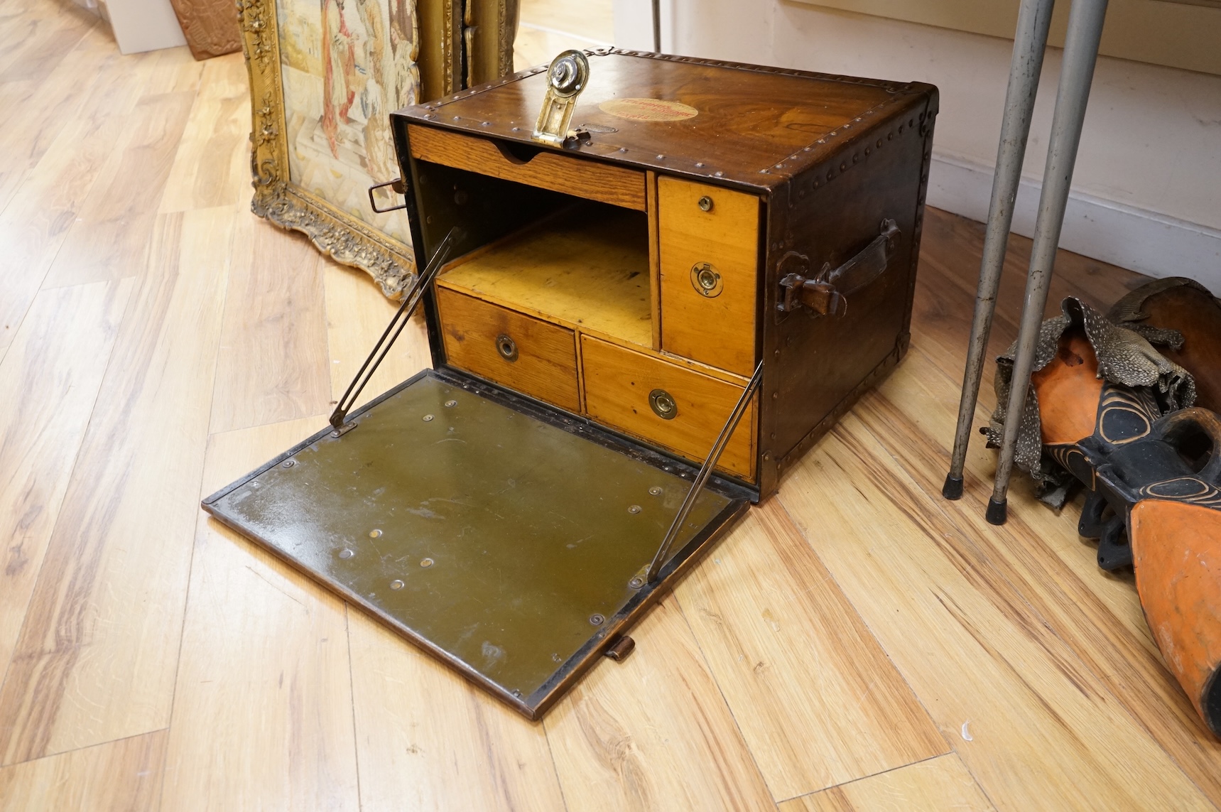 A Hartman Trunk Company metal travelling secretaire with The Grand Hotel, Paris label, with key, 52cm wide